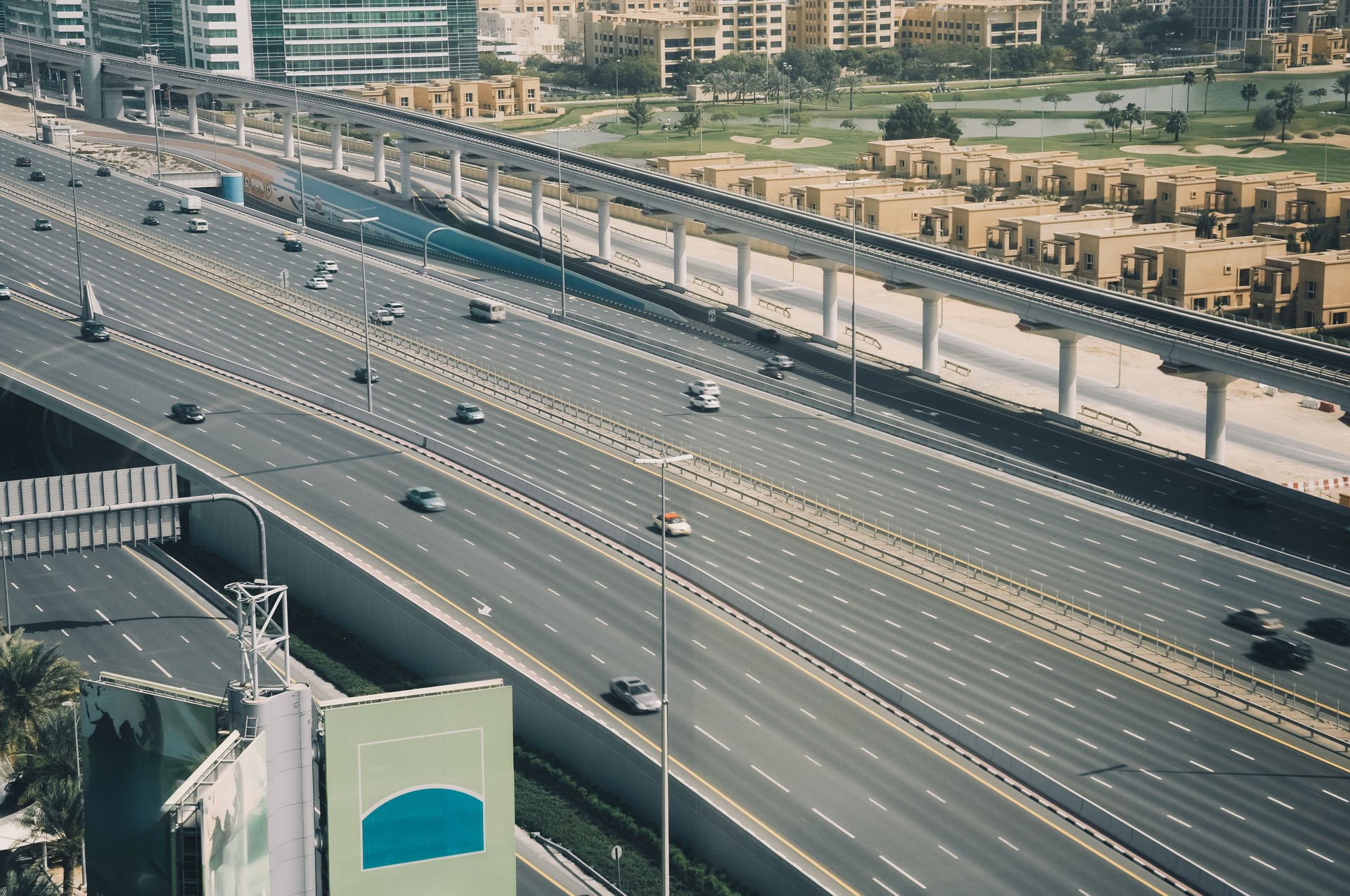 View of the famous Sheikh Zayed Road with heavy traffic and metro rails and numerous skyscrapers in Dubai Marina area stock photo